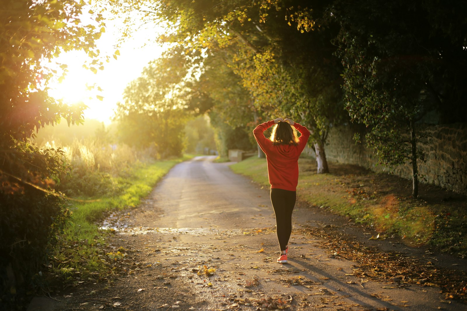 A woman moving forward alone outdoors with confidence and purpose