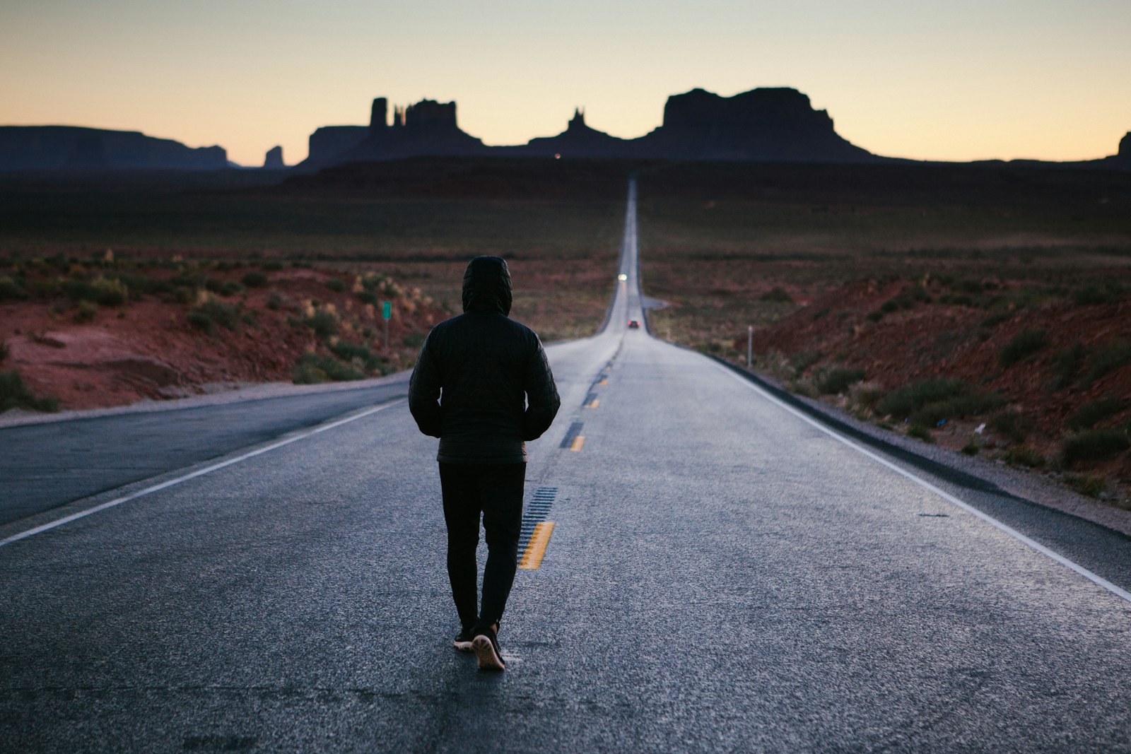 A person walking toward the sunset, symbolizing growth and transformation