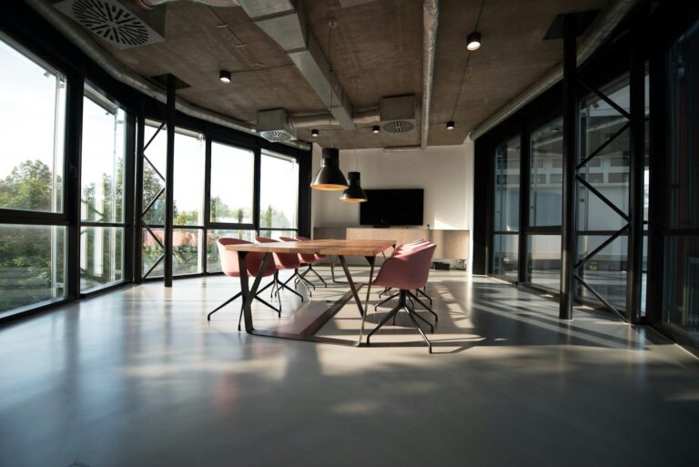 Sunlit doorway opening into a calm interior space