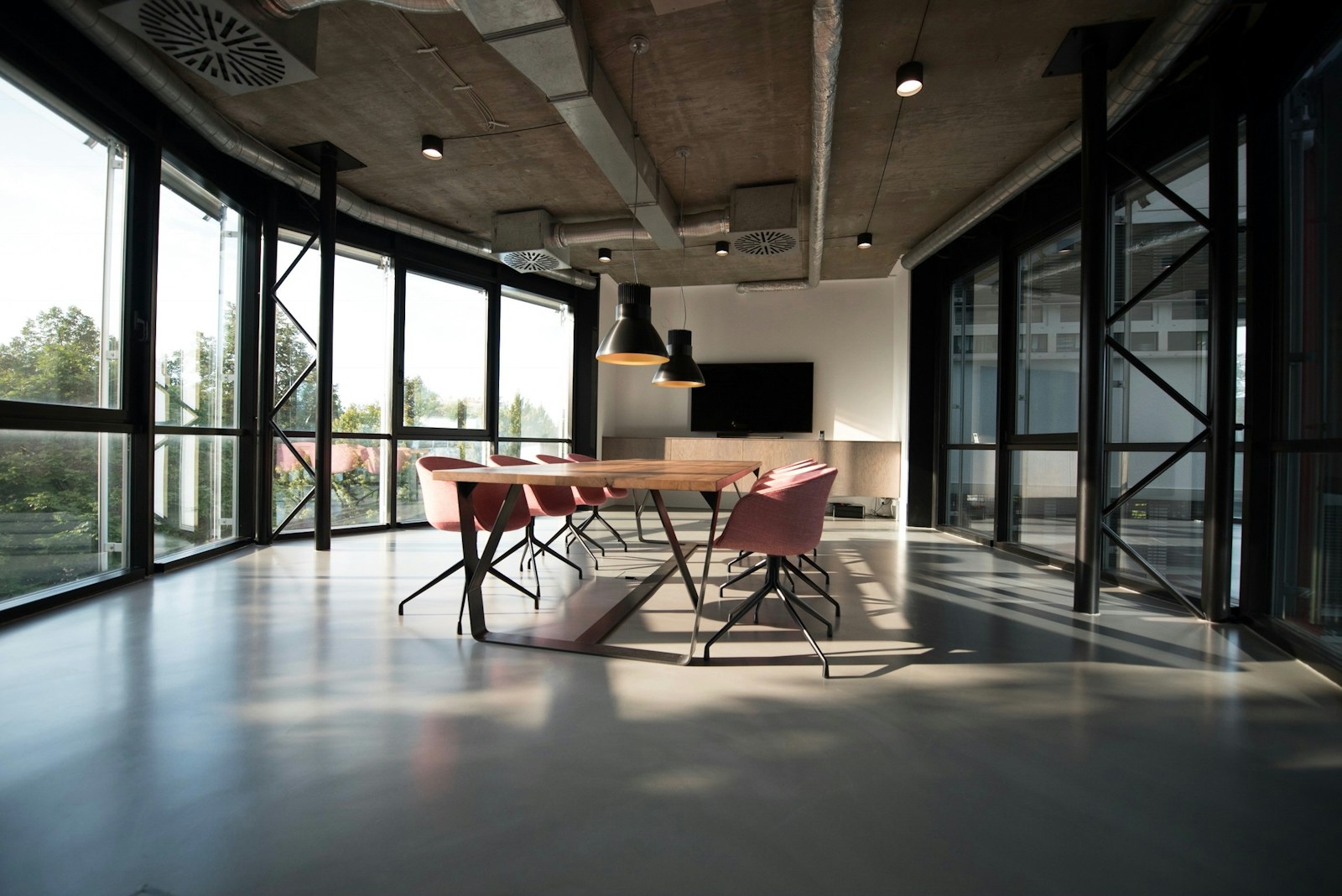 Sunlit doorway opening into a calm interior space