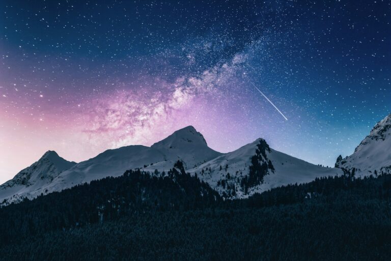 A quiet mountain landscape under a starry sky, symbolizing reflection and inner calm